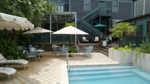 Swimming pool and shaded lounge terrace at The Chloe boutique hotel in Uptown New Orleans