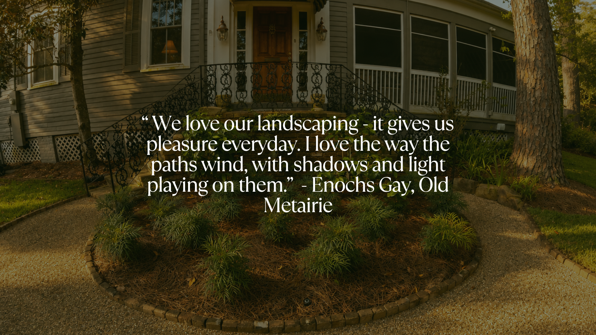 Old Metairie front garden with winding pathways and layered plantings designed by Landscape Images Ltd.